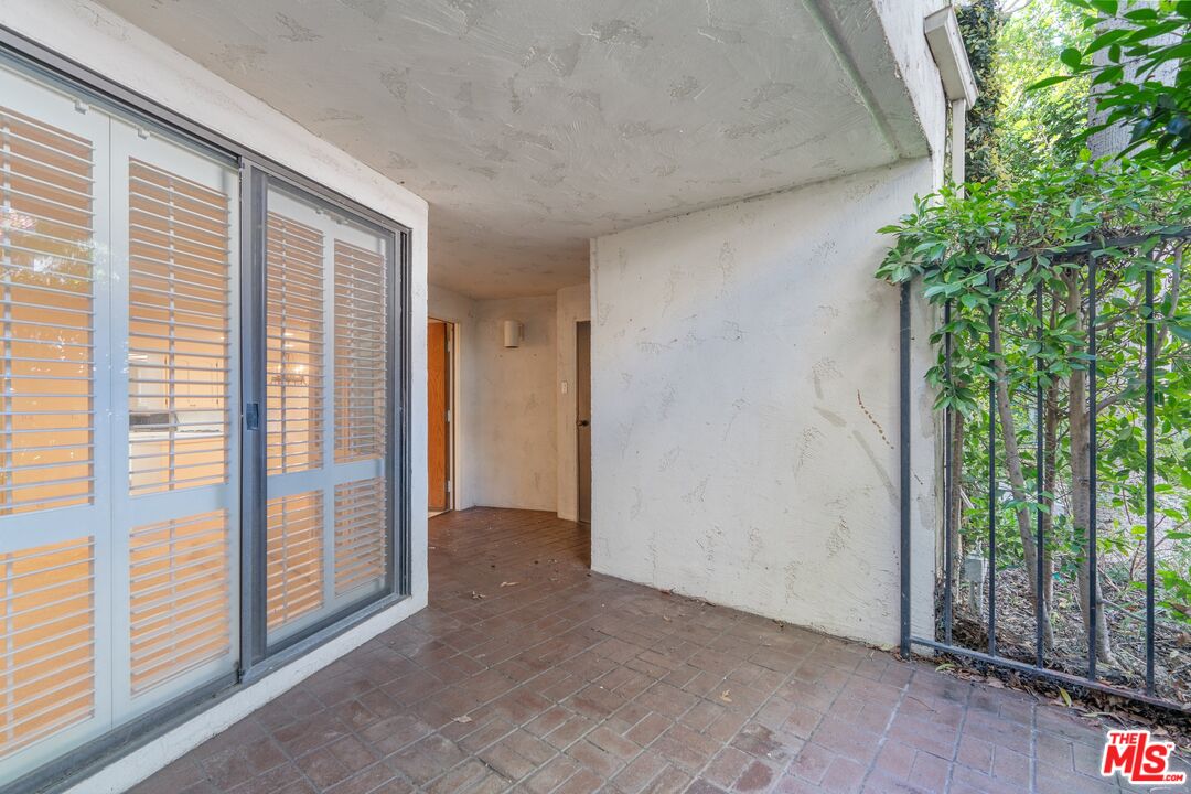 11687 Bellagio Road, Unit 5 Los Angeles, CA 90049 - Photo 4 of 31 a view of entryway with balcony