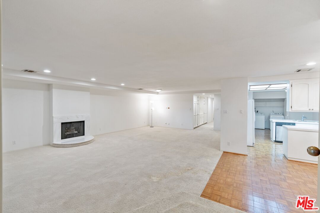 11687 Bellagio Road, Unit 5 Los Angeles, CA 90049 - Photo 6 of 31 a view of a livingroom with a furniture