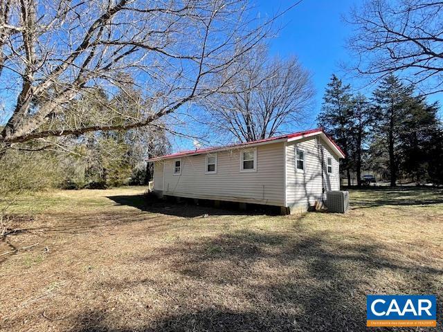 475 Liberty Road New Canton, VA 23123 - Photo 19 of 21 a view of a house with a large tree and a yard