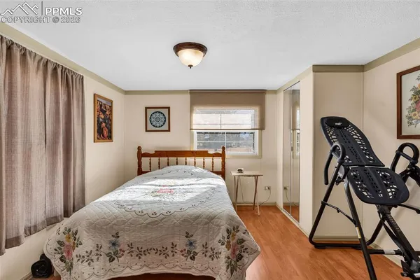 a view of a livingroom with furniture and a window