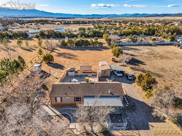an aerial view of a house with a lake view