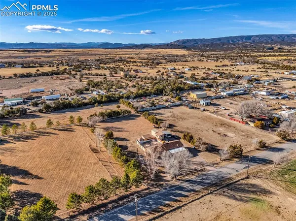 an aerial view of residential building and ocean