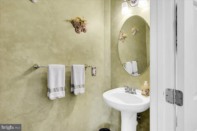 a bathroom with a sink and mirror