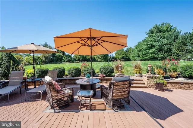 a view of a patio with furniture and yard