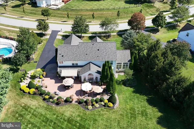 an aerial view of a house with a garden