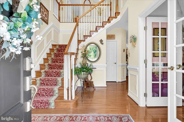 a view of entryway with wooden floor
