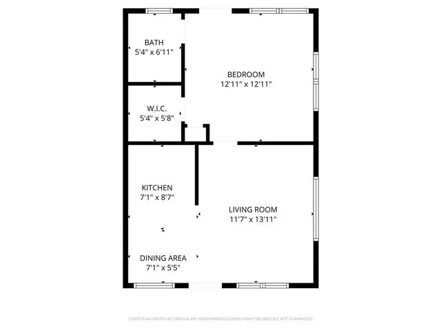 a picture of a bench in front of a wall