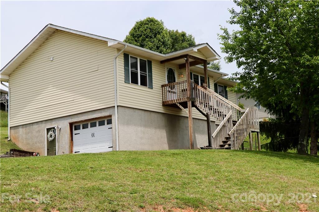 49 Sovereign Circle Clyde, NC 28721 - Photo 2 of 23 a view of a house with backyard and garden