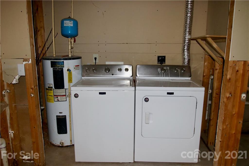 49 Sovereign Circle Clyde, NC 28721 - Photo 20 of 23 a utility room with dryer and washer