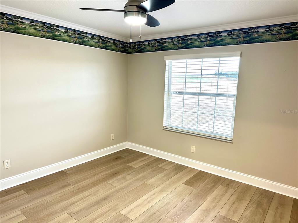 11735 Southeast 174th Loop Summerfield, FL 34491 - Photo 18 of 19 a view of a room with a window and wooden floor