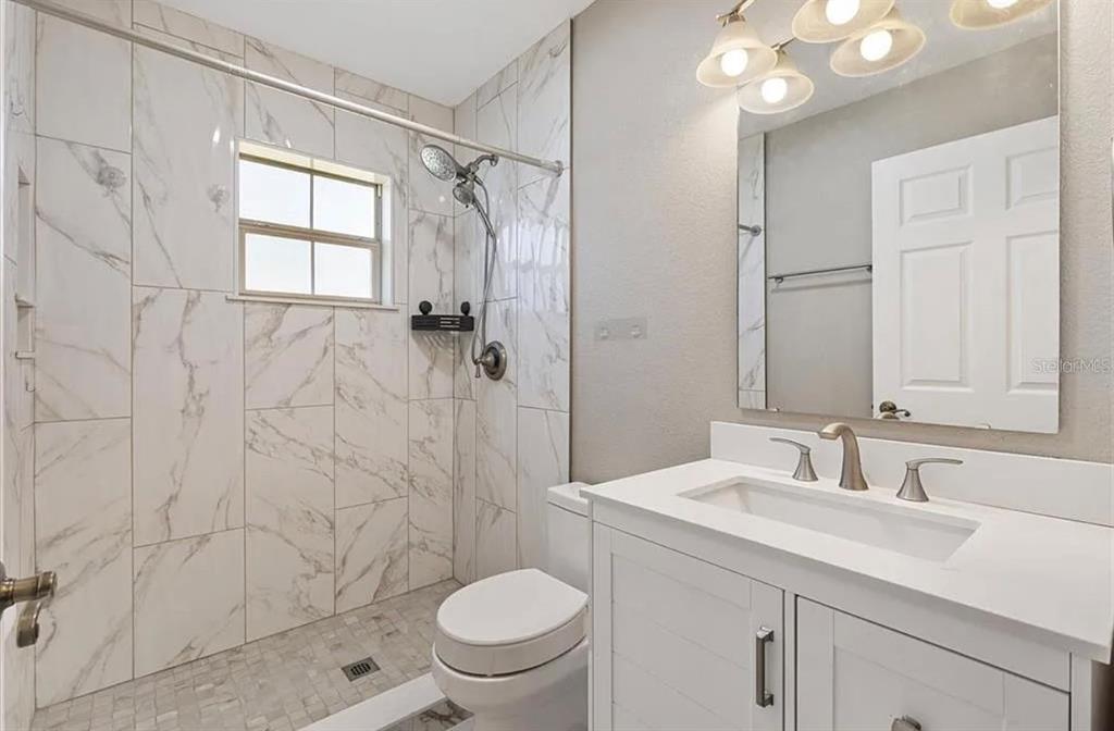 11735 Southeast 174th Loop Summerfield, FL 34491 - Photo 19 of 19 a bathroom with a sink toilet and shower