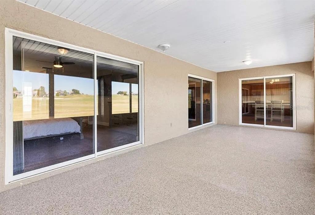 11735 Southeast 174th Loop Summerfield, FL 34491 - Photo 6 of 19 wooden floor and window in a room