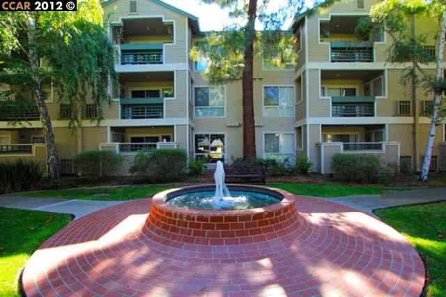 2530 Oak Road, Unit 301 Walnut Creek, CA 94597 - Photo 1 of 1 a front view of a house with a yard