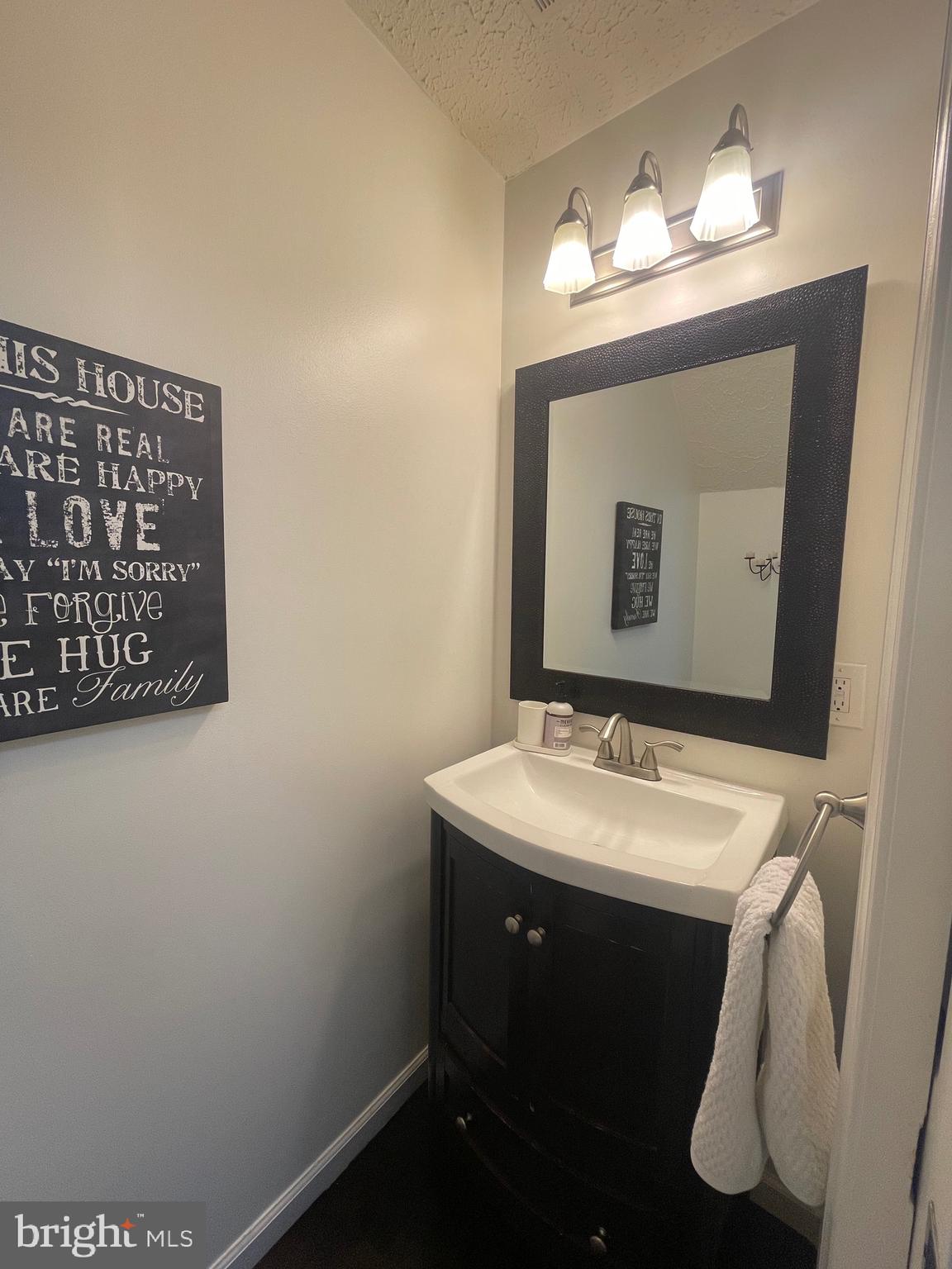 2960 McGee Way Olney, MD 20832 - Photo 11 of 25 a bathroom with a sink and a mirror