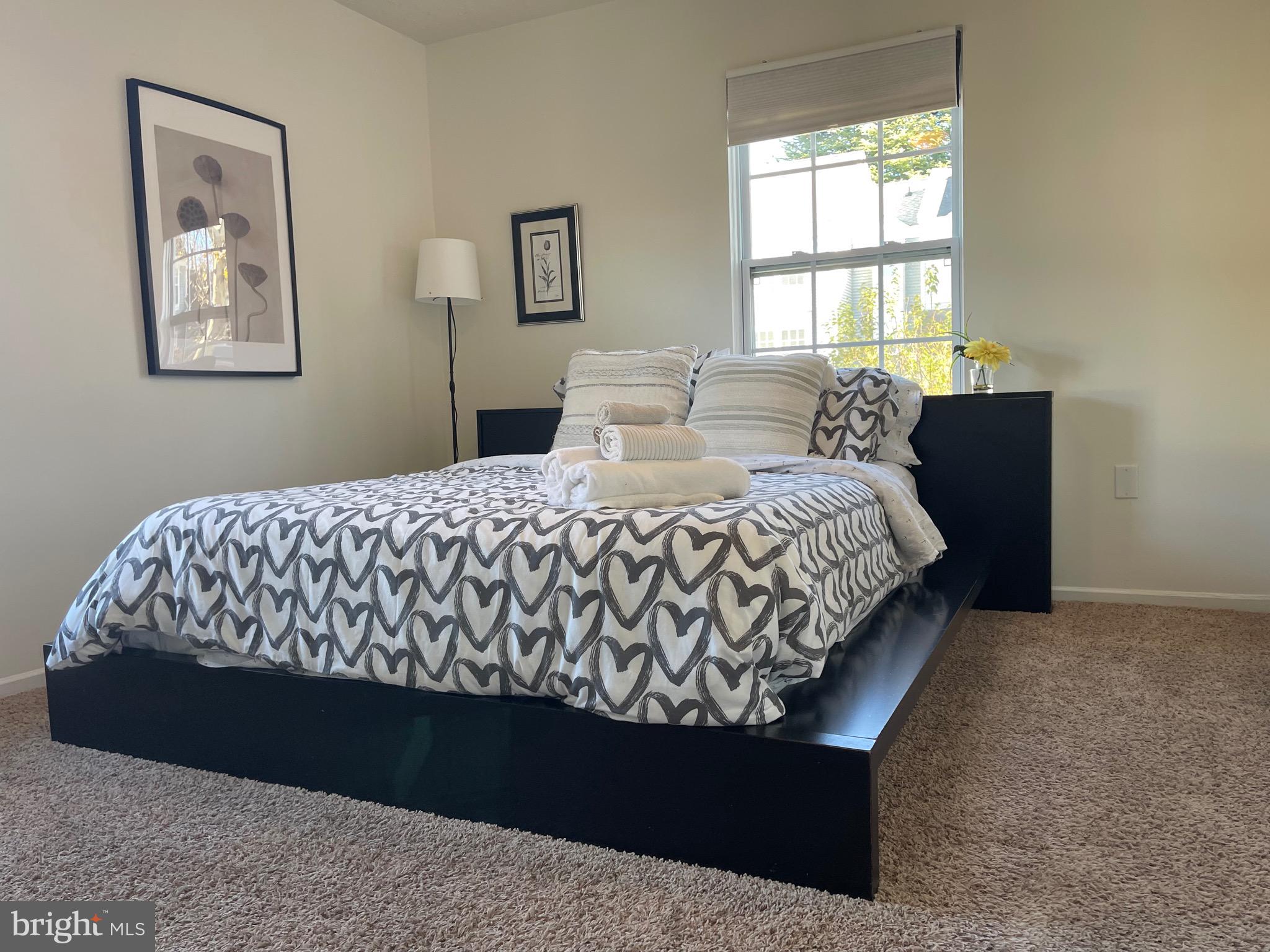 2960 McGee Way Olney, MD 20832 - Photo 15 of 25 a bedroom with a bed painting on wall and a window