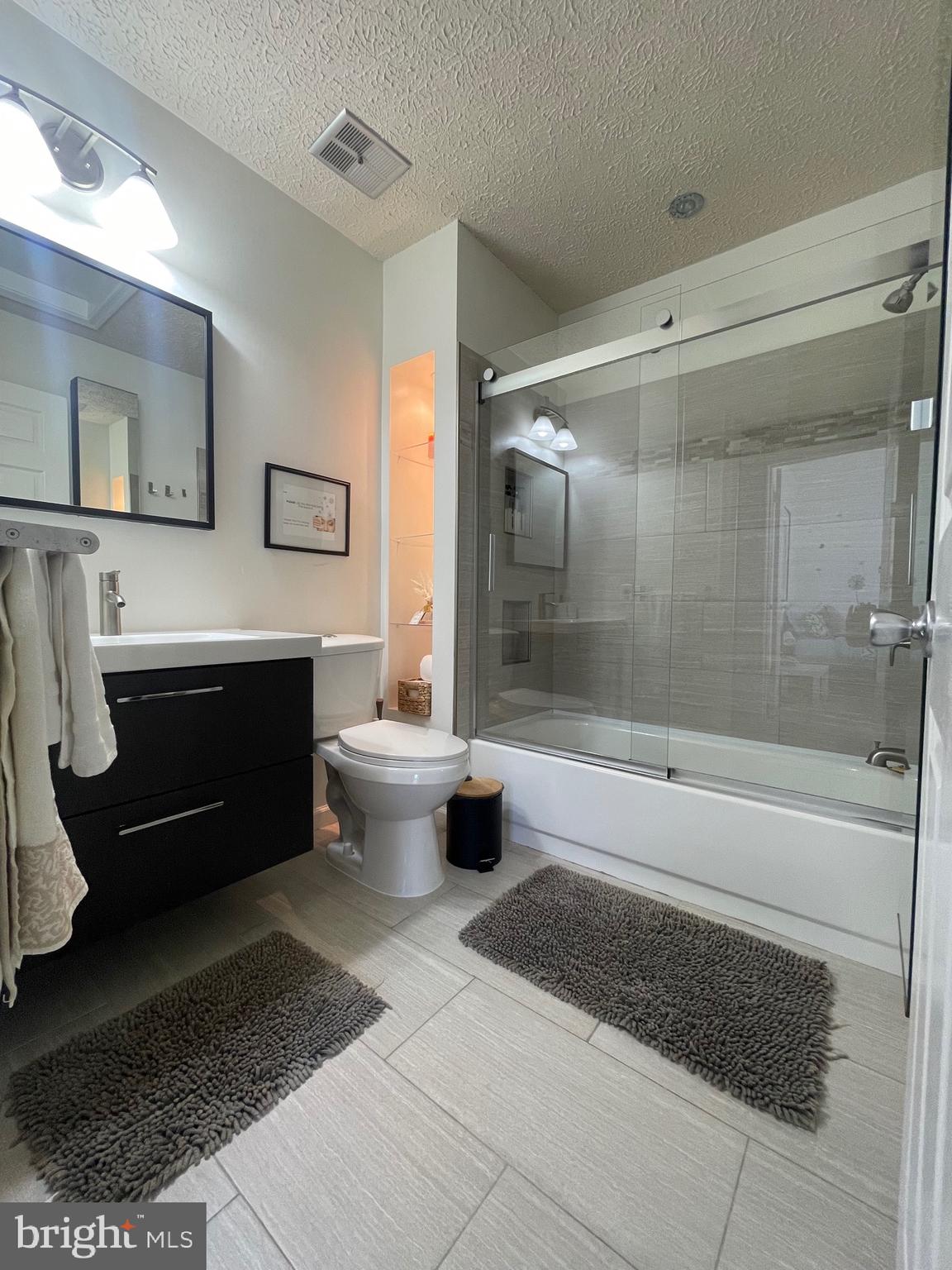 2960 McGee Way Olney, MD 20832 - Photo 17 of 25 a bathroom with a sink a toilet and shower