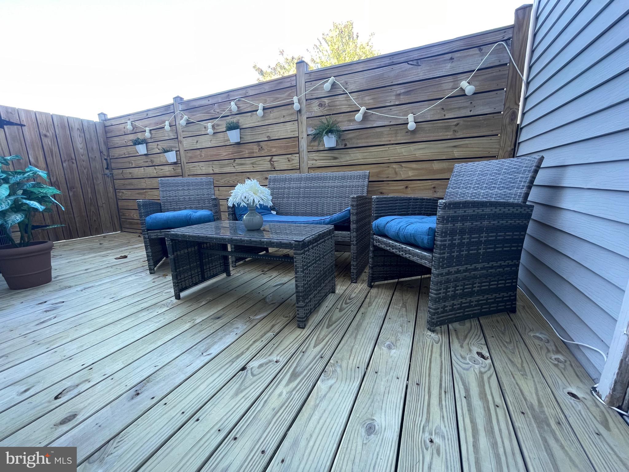 2960 McGee Way Olney, MD 20832 - Photo 21 of 25 a view of a roof deck with wooden floor and seating space