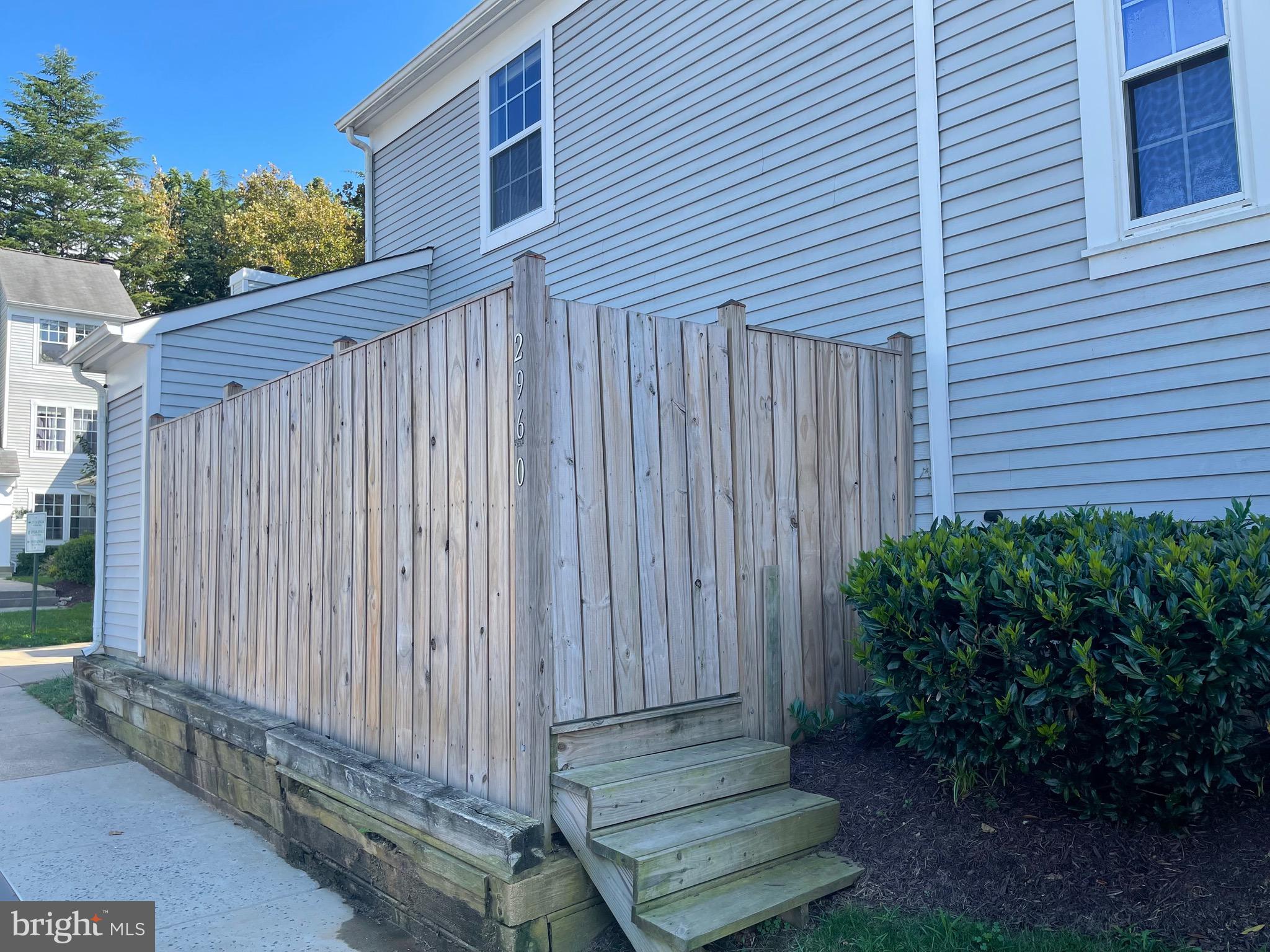2960 McGee Way Olney, MD 20832 - Photo 24 of 25 a view of a backyard with plants and wooden fence
