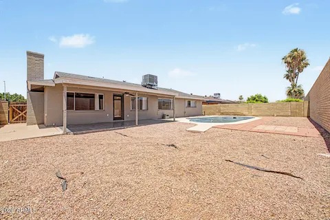 a view of a house with a yard and ocean view