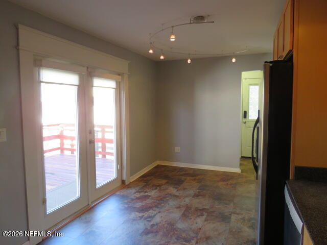 4649 Cambridge Road Jacksonville, FL 32210 - Photo 9 of 24 Kitchen eating area and French doors to