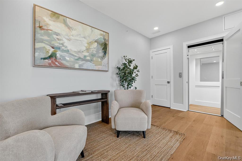 1822 Soundview Court Yorktown Heights, NY 10598 - Photo 20 of 39 a living room with furniture and a painting on the wall