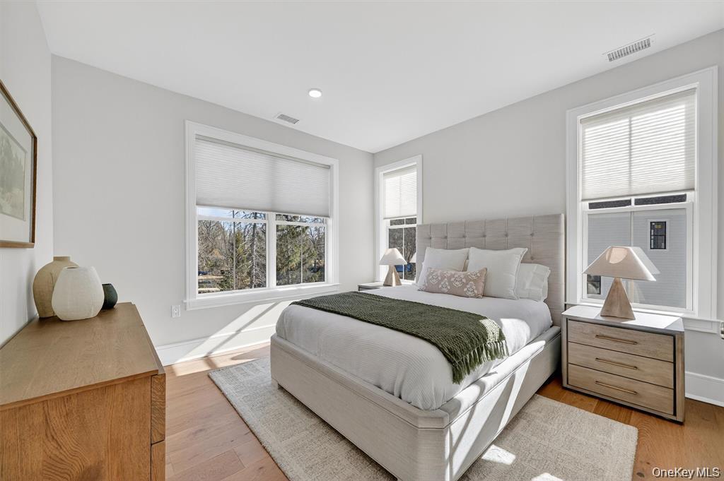 1822 Soundview Court Yorktown Heights, NY 10598 - Photo 26 of 39 a bedroom with a bed and wooden floor