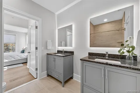 a kitchen with granite countertop a sink and a stove