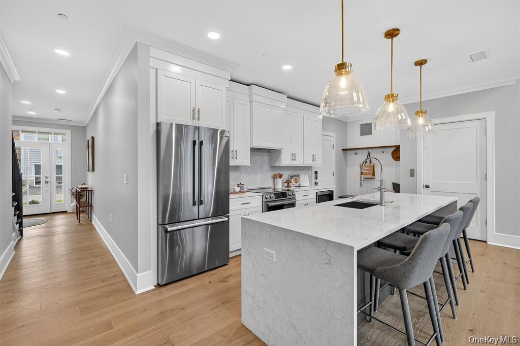 1822 Soundview Court Yorktown Heights, NY 10598 - Photo 7 of 39 a kitchen with refrigerator cabinets and wooden floor