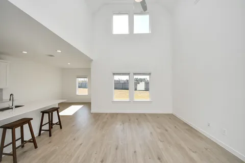 a view of an entryway with wooden floor