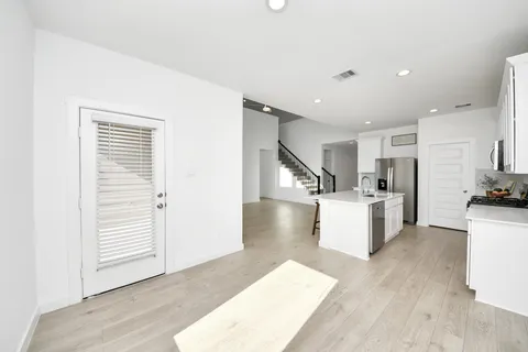 a kitchen with a sink a stove and refrigerator