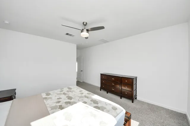 an empty room with a window and stairs