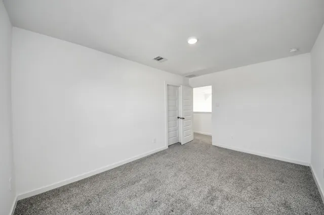 a view of a balcony with an outdoor seating