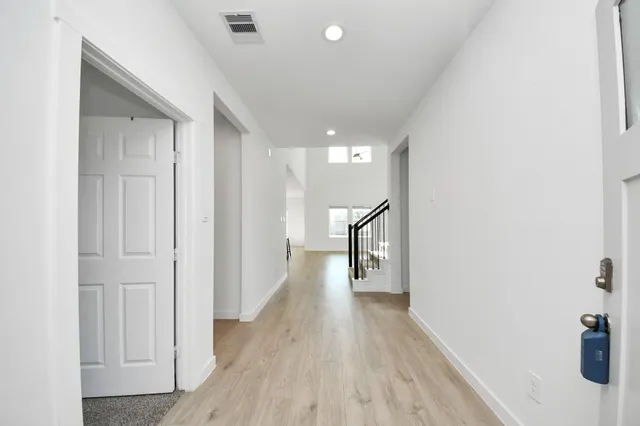 a kitchen with stainless steel appliances granite countertop a stove a refrigerator and a more cabinets