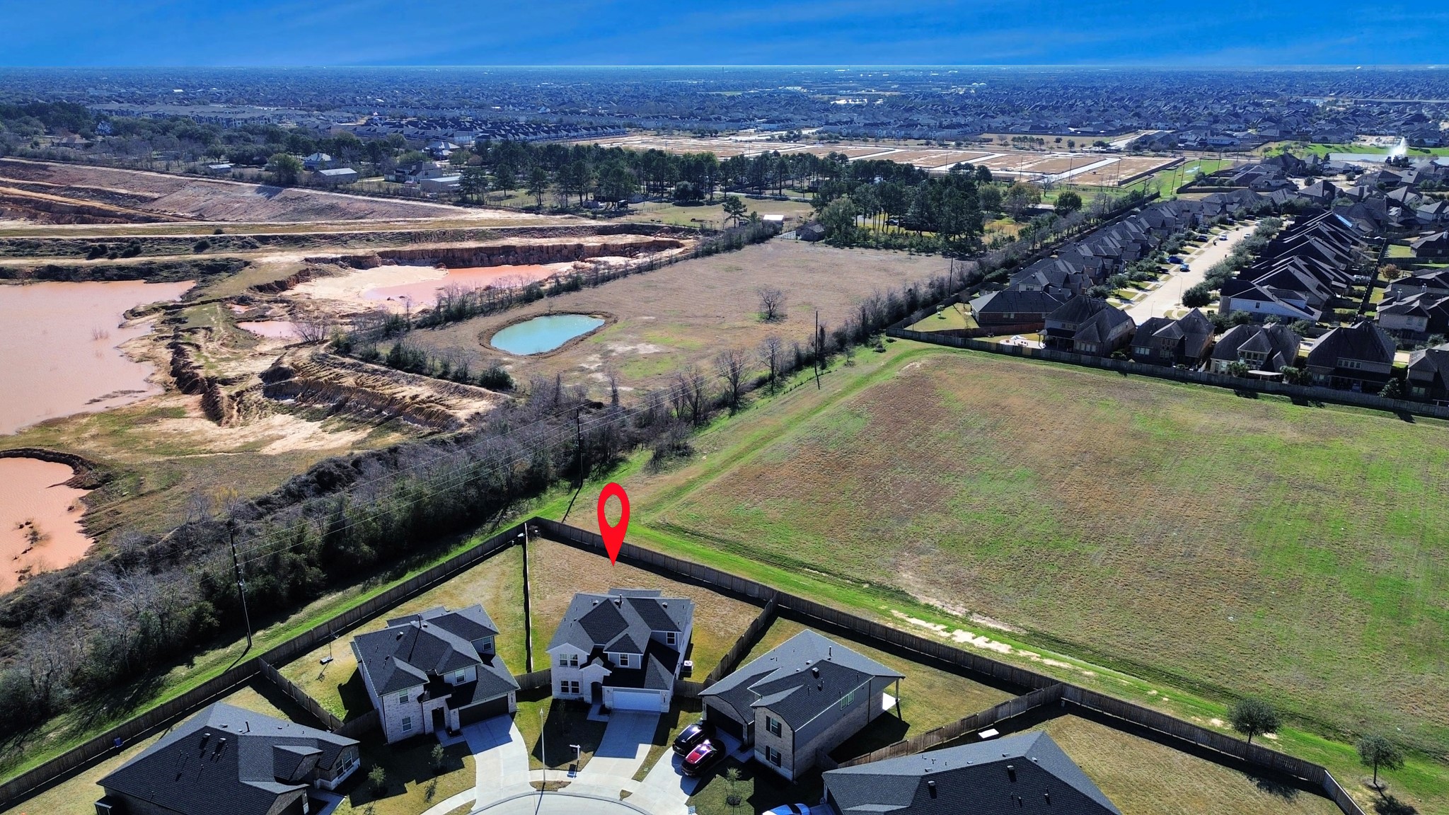 28603 Crowley Court Katy, TX 77494 - Photo 45 of 50 Located at the unique cul-de-sac with 5 other houses , featuring a large backyard with open fields beyond. The neighborhood is surrounded by natural landscapes, providing a peaceful and expansive view.