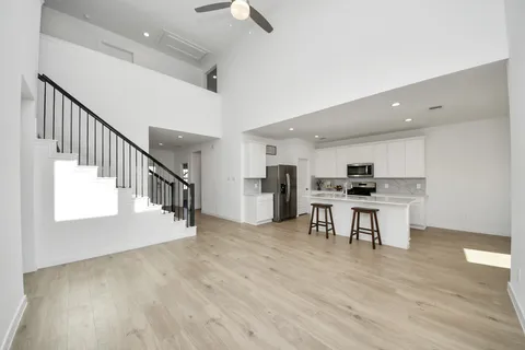 a view of kitchen with furniture and wooden floor