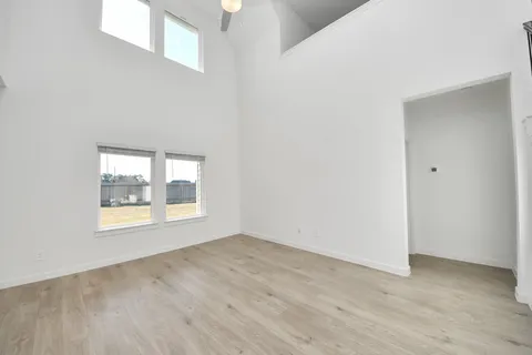 wooden floor in an empty room with a gallery