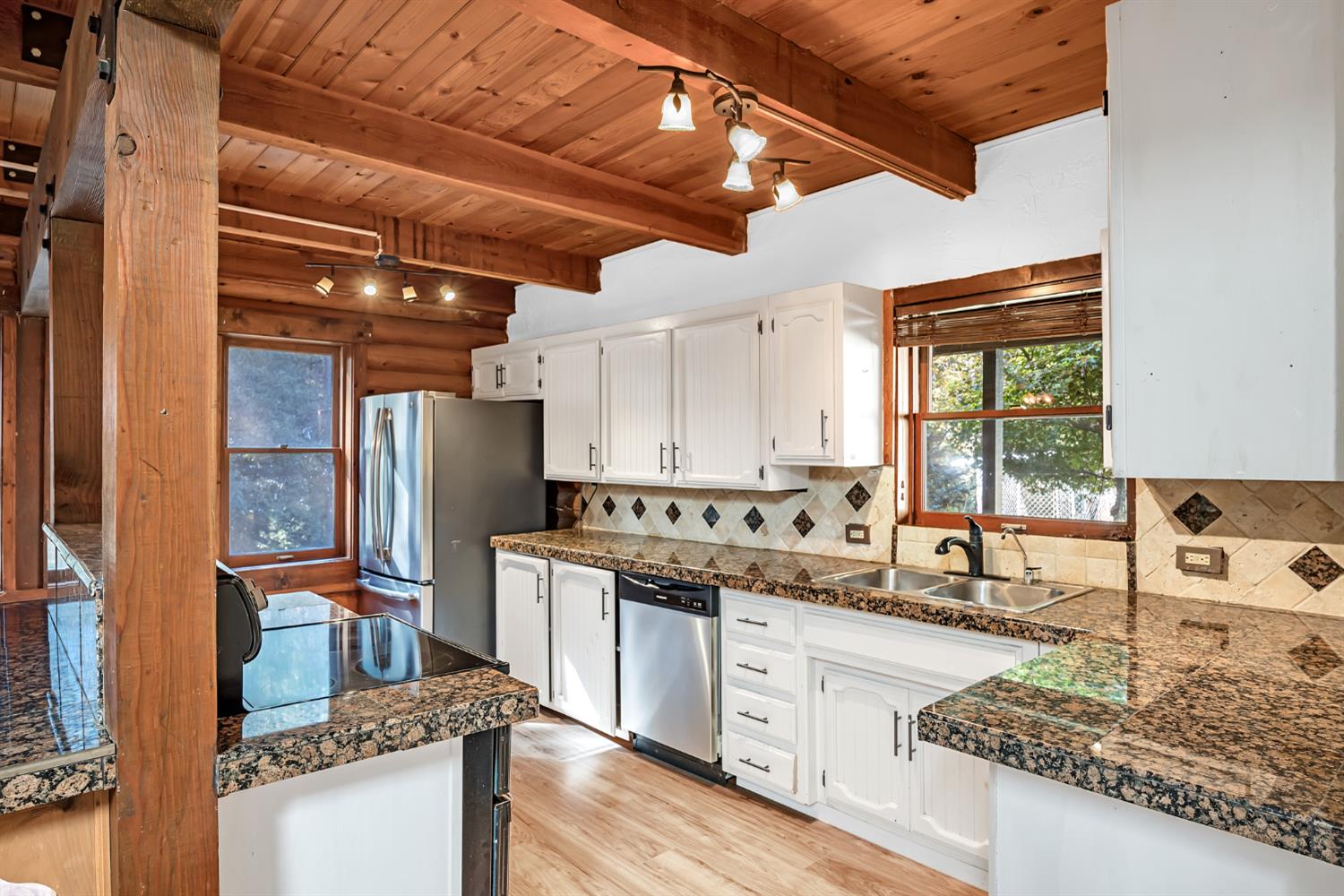 1610 Swansboro Road Placerville, CA 95667 - Photo 13 of 50 a kitchen with stainless steel appliances granite countertop a sink and cabinets
