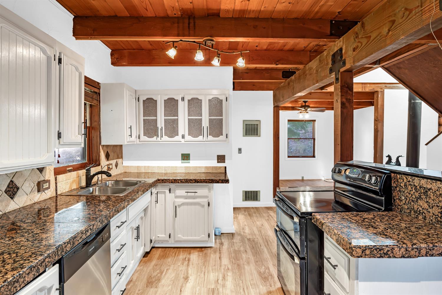 1610 Swansboro Road Placerville, CA 95667 - Photo 14 of 50 a kitchen with stainless steel appliances granite countertop a sink stove and cabinets