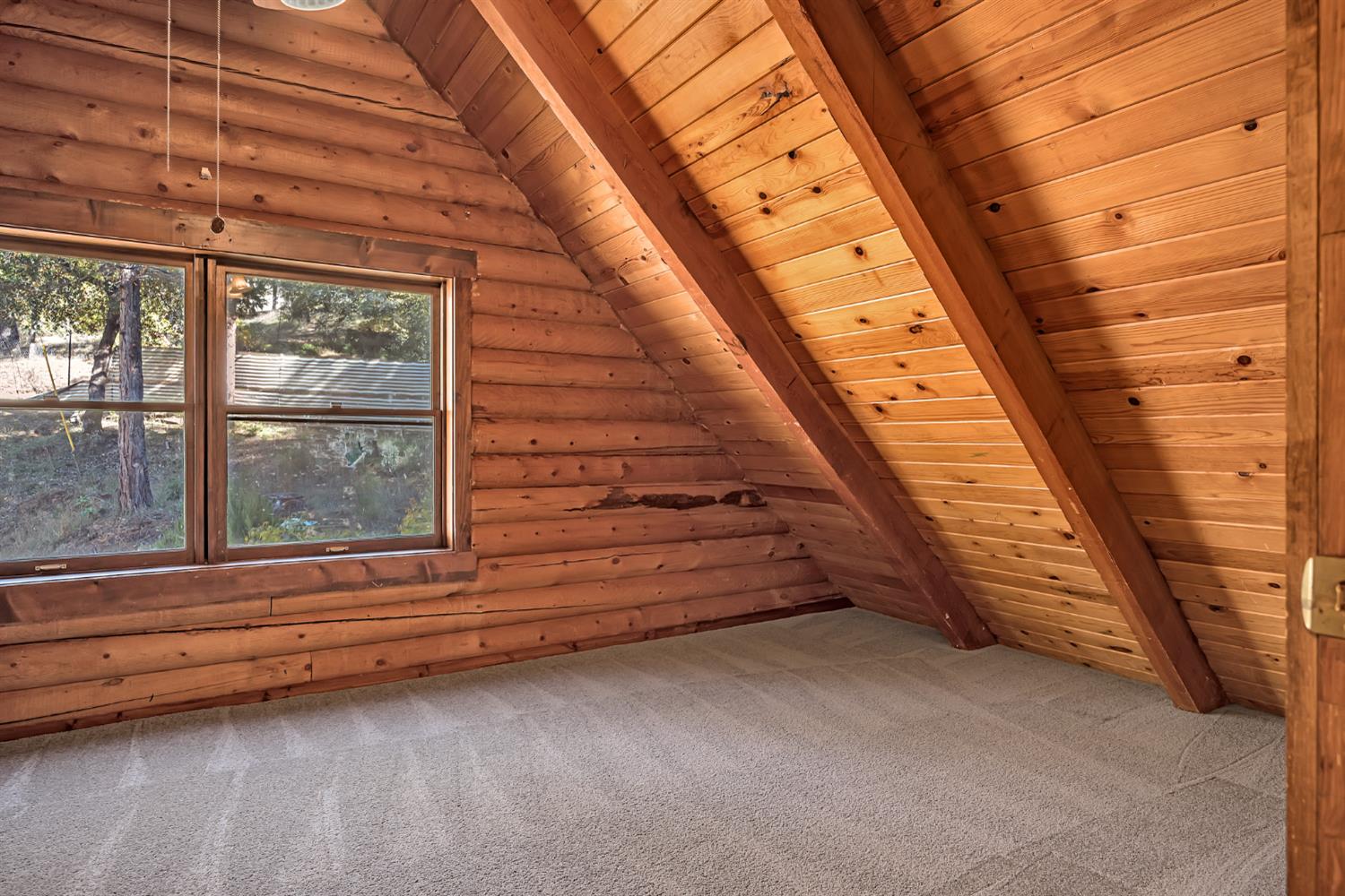 1610 Swansboro Road Placerville, CA 95667 - Photo 26 of 50 a view of a room with wooden walls and window