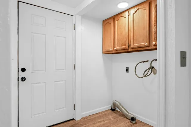 a view of an entryway with wooden floor