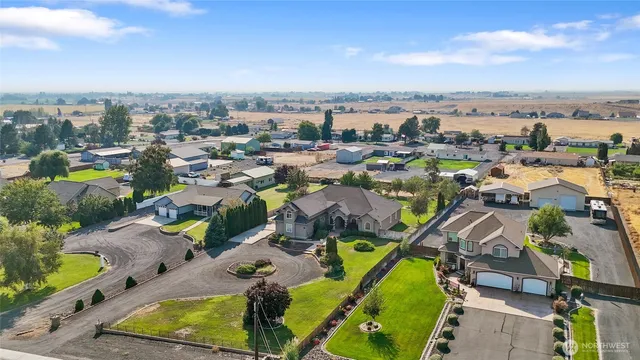 an aerial view of a house with a lake view