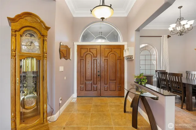 a view of hall way with furniture