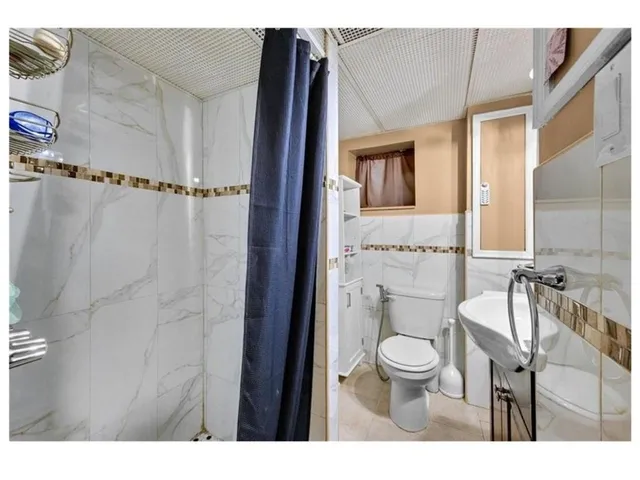 a bathroom with a toilet and a sink