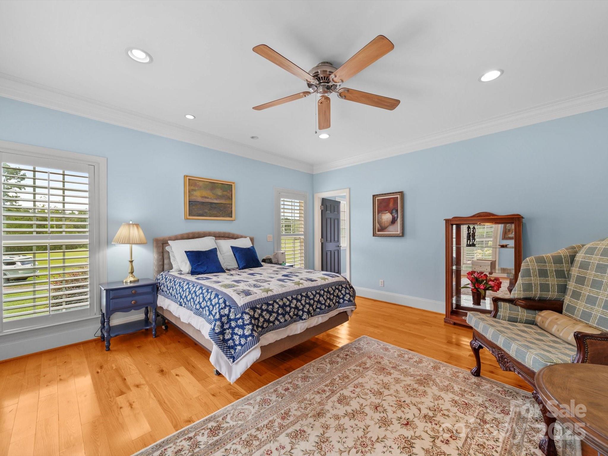 1393 Wateree Road Ridgeway, SC 29130 - Photo 17 of 42 a bedroom with a bed and a chandelier