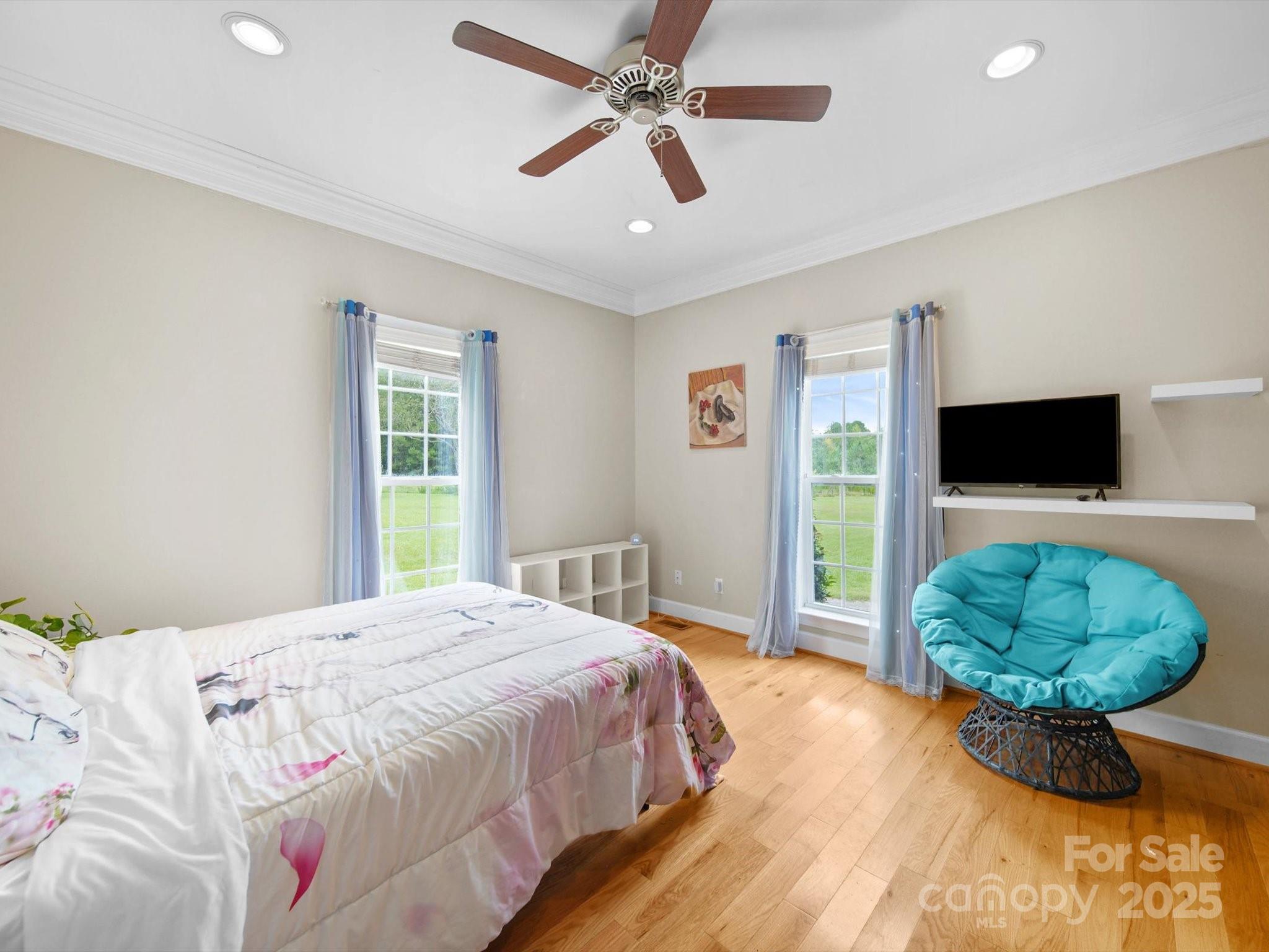 1393 Wateree Road Ridgeway, SC 29130 - Photo 21 of 42 a bedroom with a bed and a television