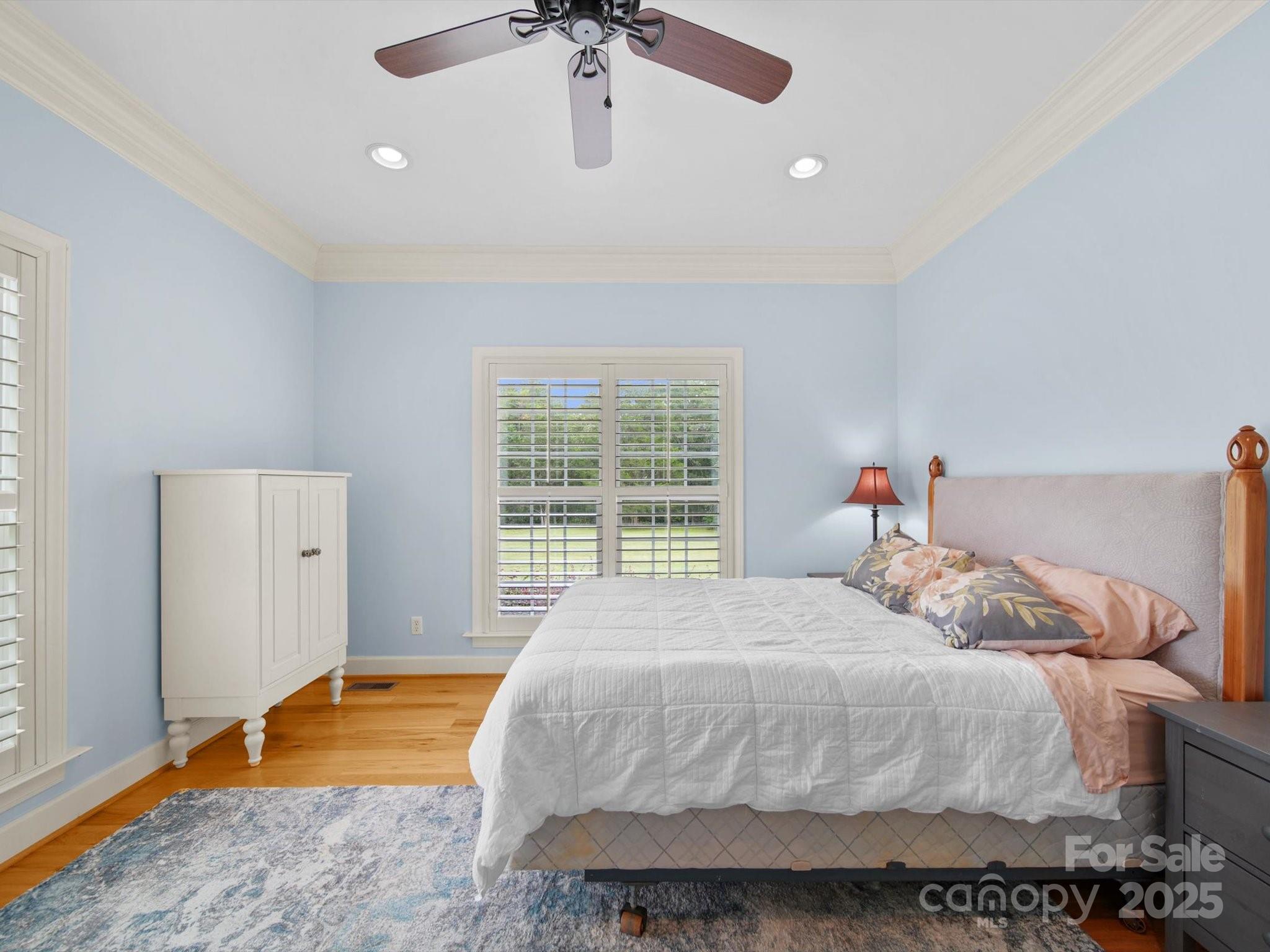 1393 Wateree Road Ridgeway, SC 29130 - Photo 25 of 42 a bedroom with a bed and a chandelier