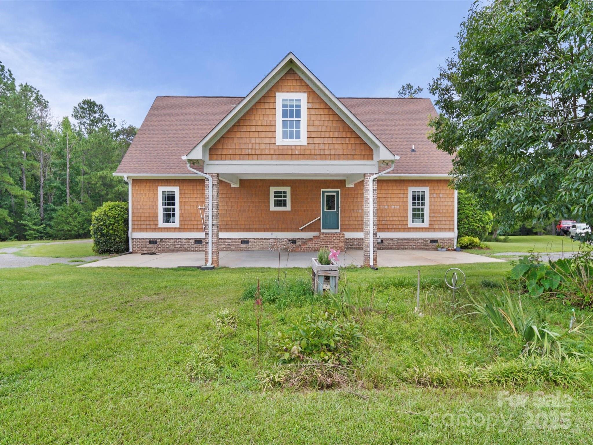1393 Wateree Road Ridgeway, SC 29130 - Photo 3 of 42 a front view of house with yard and green space