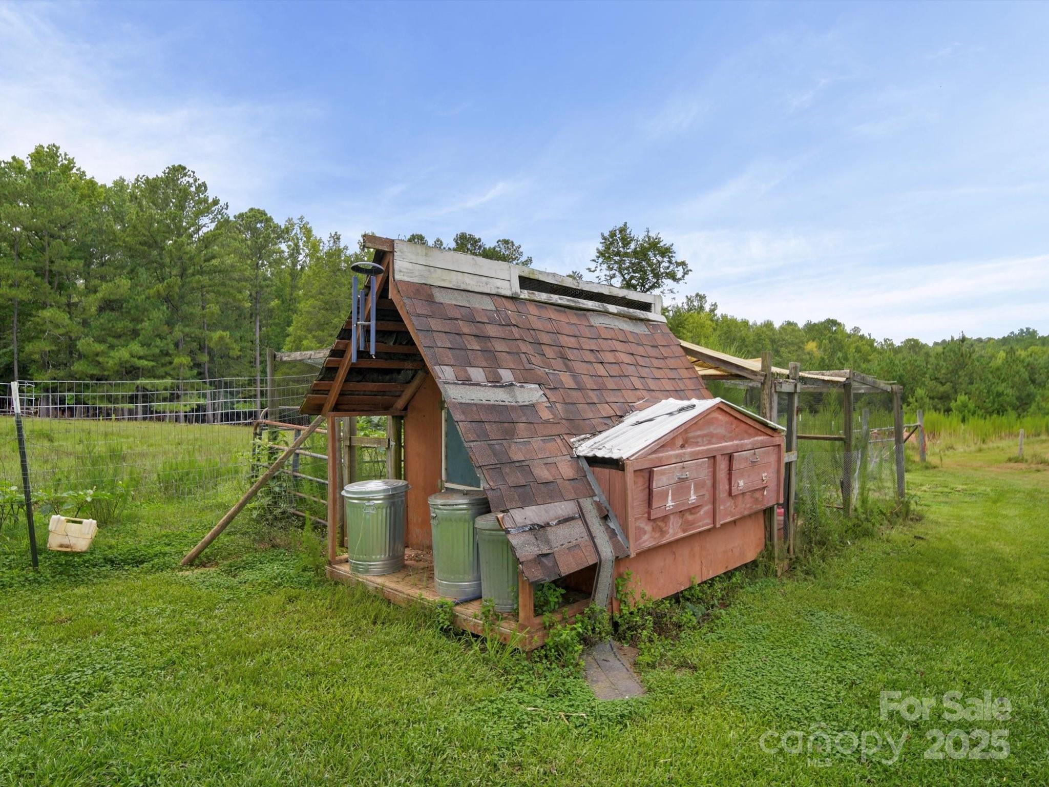 1393 Wateree Road Ridgeway, SC 29130 - Photo 40 of 42 a aerial view of a house next to a big yard and large trees