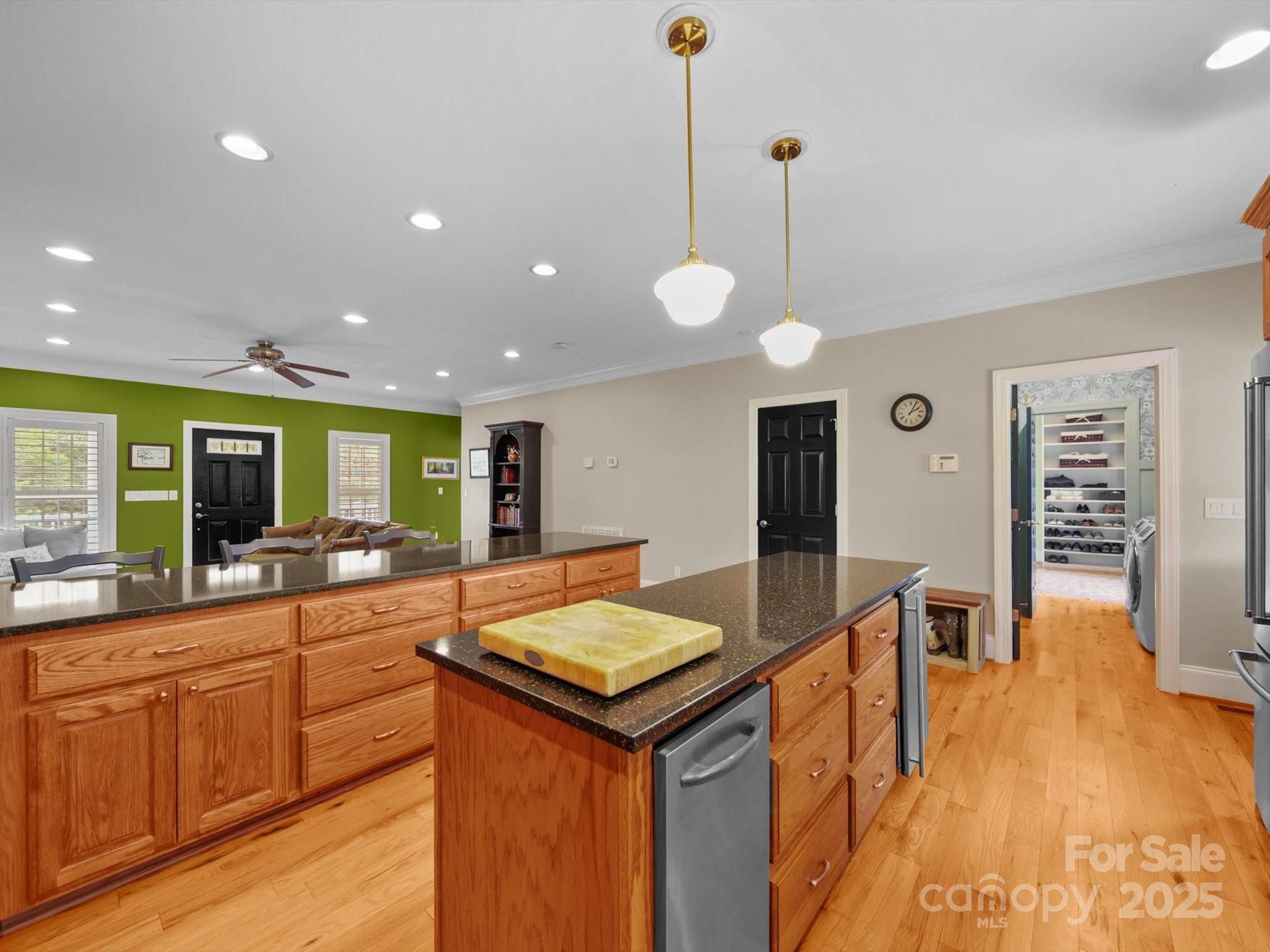1393 Wateree Road Ridgeway, SC 29130 - Photo 10 of 42 a kitchen with a stove a sink a dining table and chairs with wooden floor