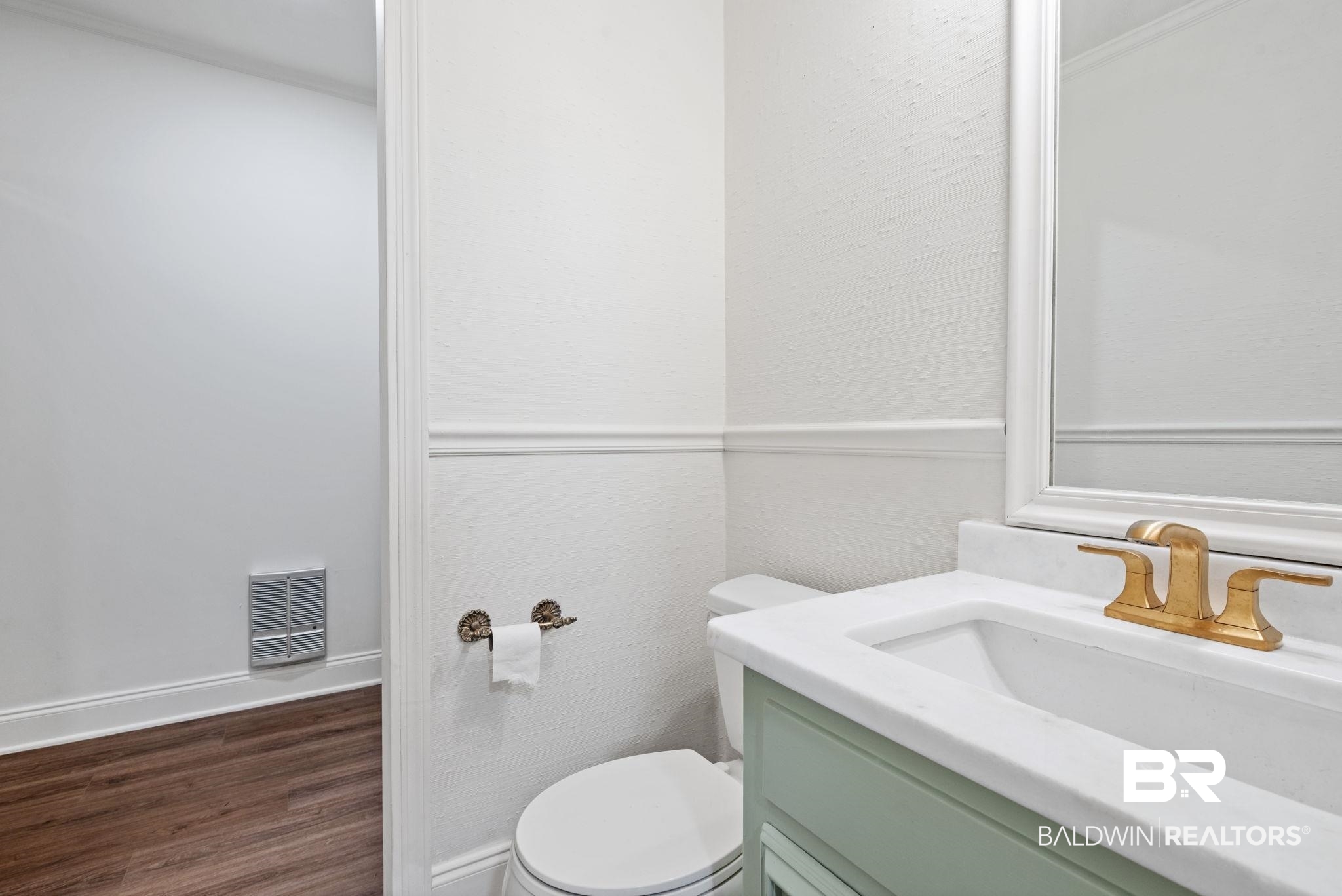 511 Wacker Lane North Mobile, AL 36608 - Photo 24 of 45 Half bathroom featuring vanity and dark wood finished floors